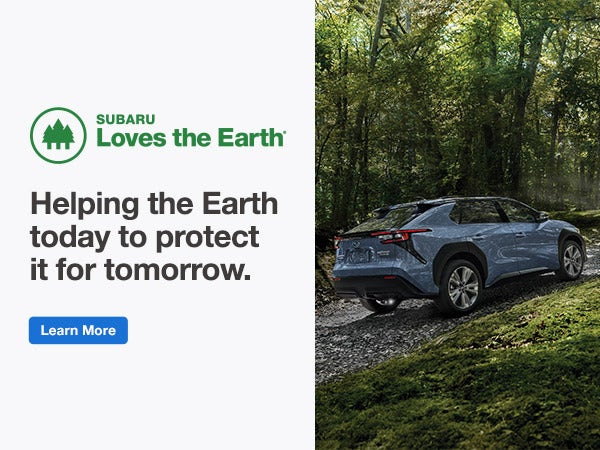o	Subaru Loves the Earth. Subaru Solterra driving on a grave